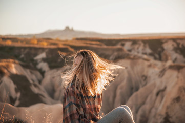 beautiful woman traveler at mountains on sunset. travel, lifestyle, instagram concept