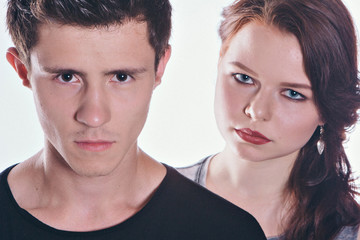 Cropped image of a beautiful couple looking at the camera standing right