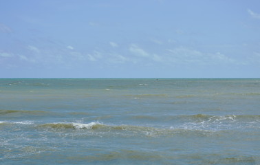 landscape of sea and water surf to beach in sunshine day