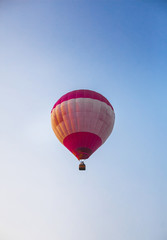 hot air balloon in flight on blue sky