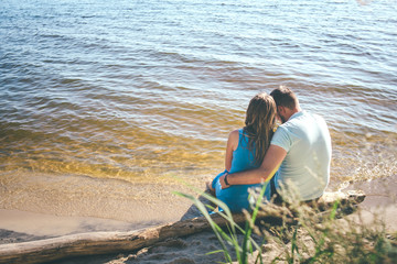 Fototapeta premium couple is hugging sitting to the sun