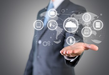 Man holding business elements icons on screen