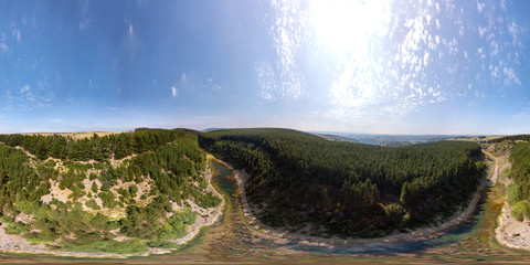 Aerial 360 degree panorama of a beautiful canyon located in a tree lined gorge in the UK