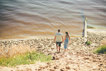 loving couple is walking to the river