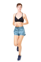Healthy young woman running on isolated white background