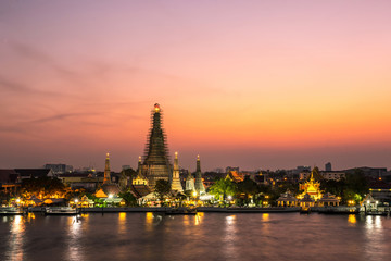 beautiful sunset wat arun temple chao phraya river, landscape Bangkok Thailand