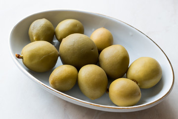 Pickled Unripe Green Almond Pickles in Plate / Cagla Badem