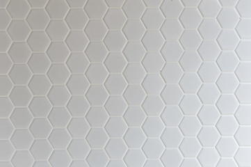 A simple white texture pattern of hexagons as a background