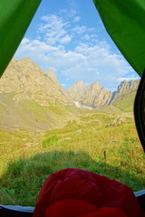 Camping with a view on Chaukhi mountain pass from Abudelauri Green Lake in Caucasus mountains, Georgia