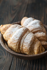 Croissants with icing on the plate