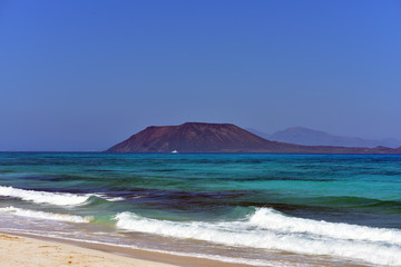 View of Lobos Island from Corralejo beach in Fuerteventura Island, Canary Islands, Spain