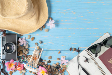 accessories for travel on blue wood background