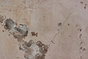 Classic travertine texture. Brown structure with fractures and spots. Used as a background.
