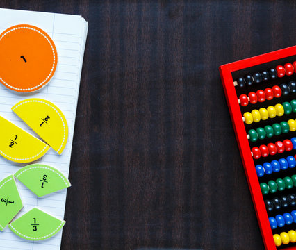 colorful fractions and abacus on the classboard. Education, interesting math concept, back to school