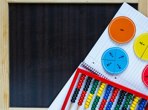 colorful fractions and abacus on the classboard. Education, interesting math concept, back to school