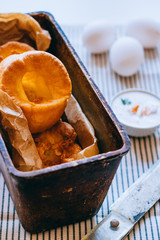 Yorkshire puddings with fish filling, in an old metal tray