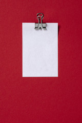 white paper massage on red background. Flat lay, top view trendy for banner