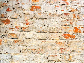 The texture of the old brickwork from the tattered red brick. Building background