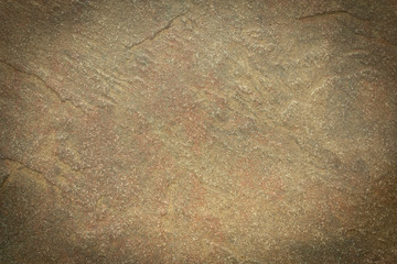 Home construction planning and design for earth tone walls and floors using natural stone and rock for building materials.