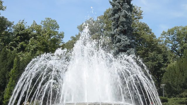 Fountain water jets changing shapes of spraying in public park in Vrnjacka Banja, Serbia.