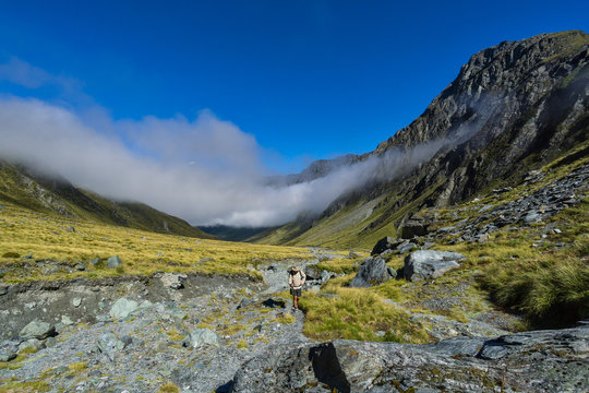 Man Hiking in the Upper Rees Valley, Mt Aspiring National Park, South Island, New Zealand