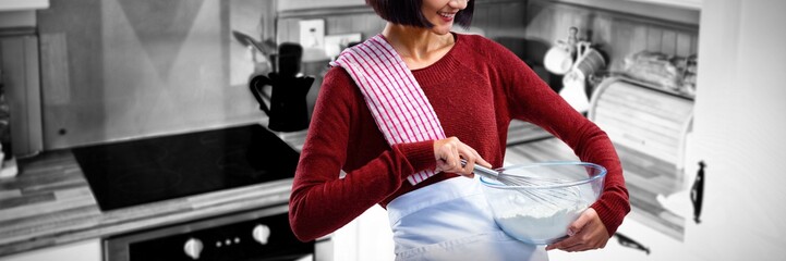 Composite image of female chef mixing flour in bowl with whisk
