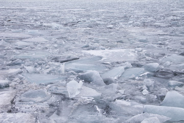 Background. Blocks of ice on the river