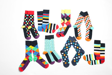 Fototapeta na wymiar Flat lay composition with different colorful socks on white background