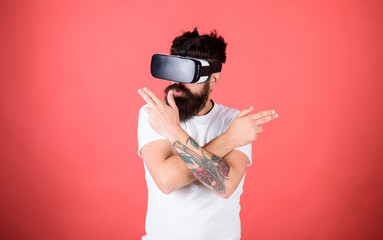 Shooting gallery VR. Man bearded hipster with virtual reality headset on red background. Man hand...