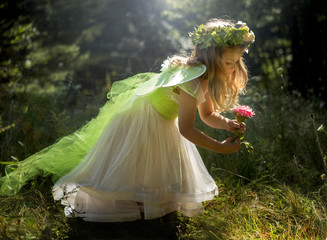 Little girl dressed as a fairy.