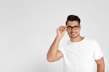 Portrait of handsome young man and space for text on white background