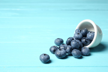 Juicy and fresh blueberries on wooden table. Space for text