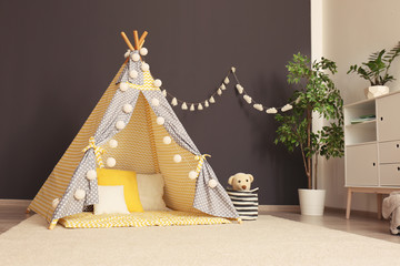 Cozy kids room interior with play tent and toys © New Africa