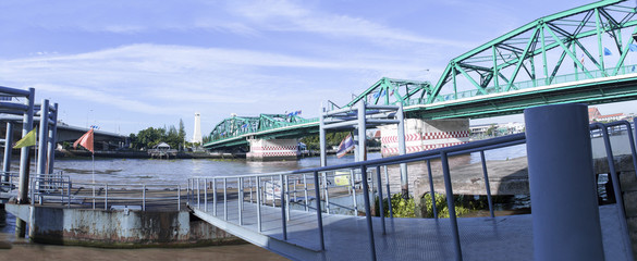 Naklejka premium Phra Phuttha Yodfa Bridge, Memorial Bridge in Thailand.Morning light cloudy and blue sky.Copy right and panorama.