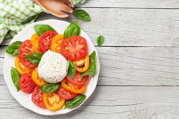 Caprese salad with tomatoes, basil and mozzarella