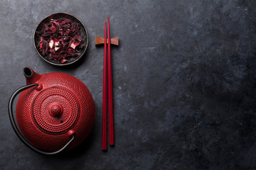 Red tea pot and sushi chopsticks