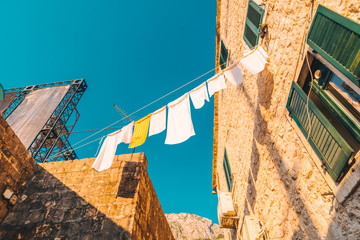 drying underwear at tight kotor street on sunset