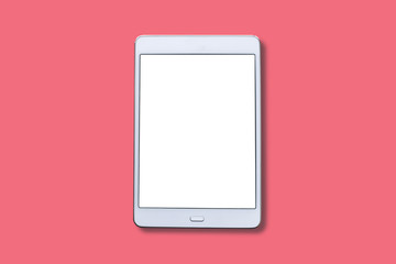 A white tablet with a blank screen on a red background.