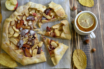 Homemade galette with apples plums and nuts