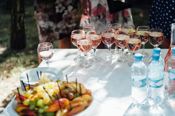 Delicious snacks on wedding reception table in luxury outdoor restaurant