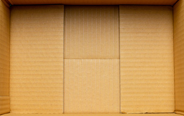 Naklejka na ściany i meble Inside a empty cardboard packaging box.
