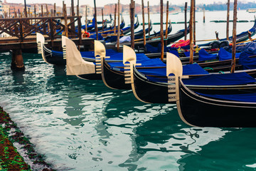 Fototapeta na wymiar Rows of traditional wooden gondolas