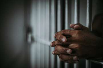 Hands of men desperate to catch the iron prison,prisoner concept,thailand people,Hope to be free.