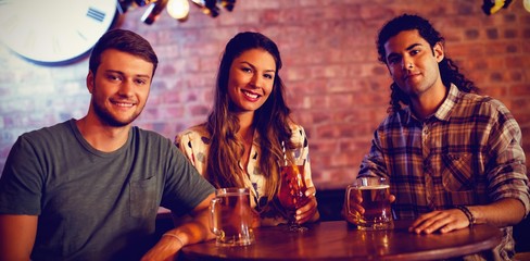 Portrait of young friends having cocktail drink