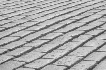 black and white photo of cobblestones pavement of old town
