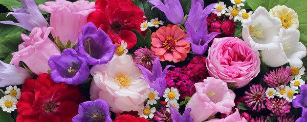 Garden cultivated flowers: roses, peonies. background, top view.
