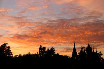 Obraz premium Church Of Our Lady Of Tikhvin. The Church Of St. Nicholas. Silhouettes in the light of sunset. Yaroslavl.