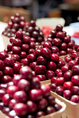 Piles of Red Cherries in a Produce Market