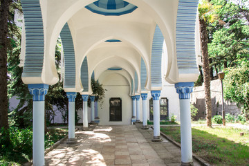 Fototapeta premium Dulber Palace made in Oriental style, blue mosque with palm trees