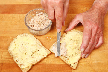 Hands making a sandwich